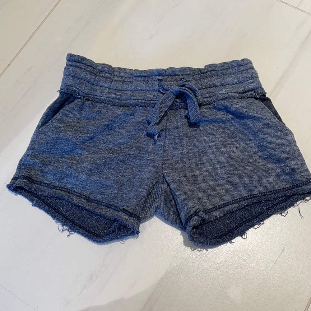 LIKE NEW DARK BLUE GIRLS SHORTS WITH POCKETS AND FRAYED EDGING